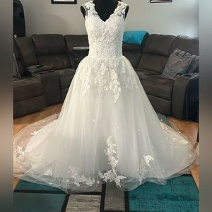 Wedding dress size 12. New never worn with all tags.